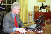 U.S. President Bill Clinton shops on the internet at his Oval Office desk December 20. This is the first time the president shopped on the internet, and it was for family Christmas presents.