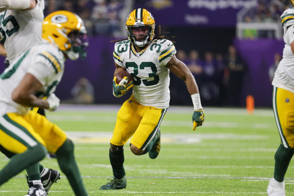 Green Bay Packers' Aaron Jones runs during the first half of an NFL football game against the Minnesota Vikings Sunday, Dec. 31, 2023, in Minneapolis. (AP Photo/Bruce Kluckhohn)