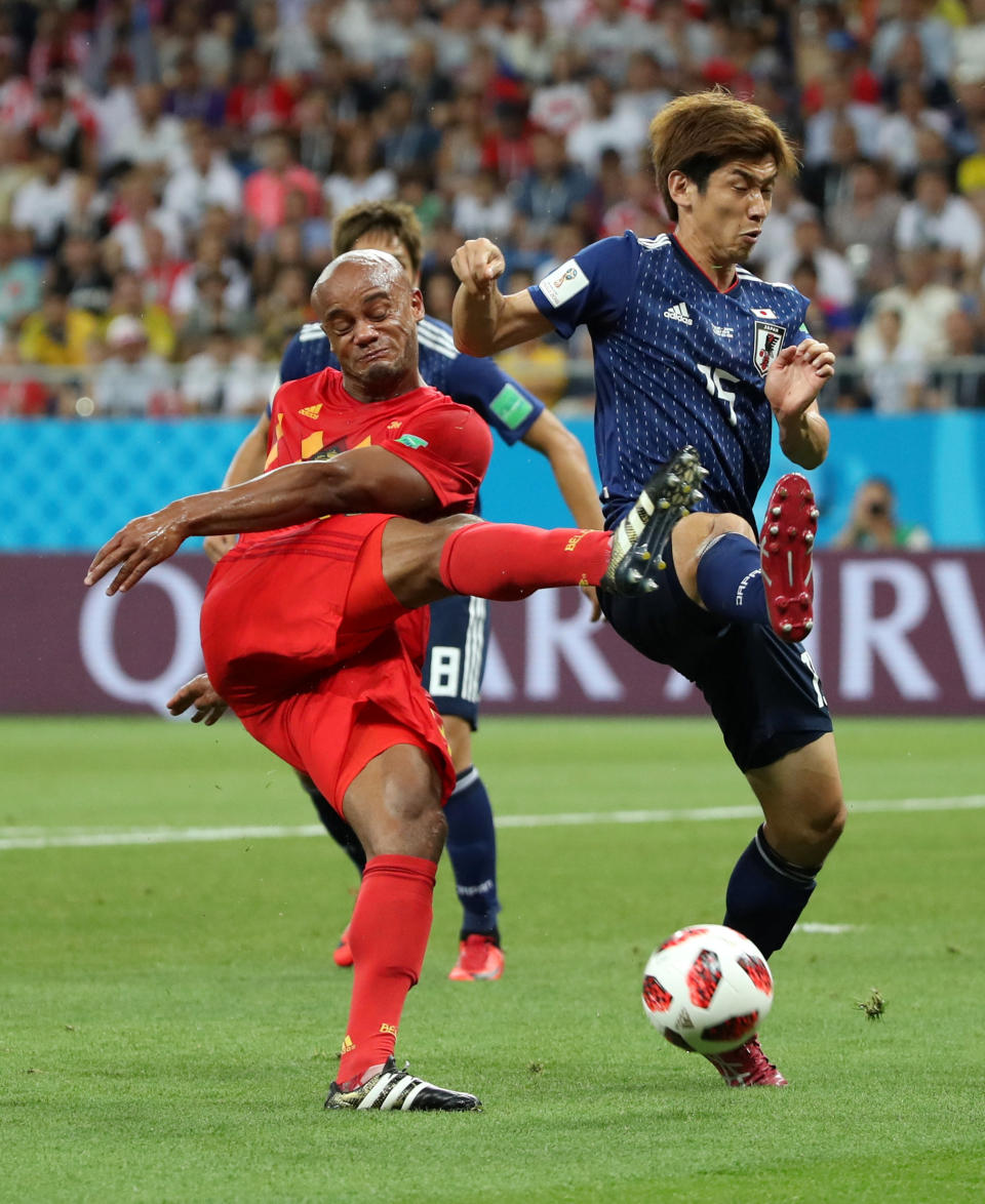 <p>Belgium’s Vincent Kompany in action with Japan’s Yuya Osako REUTERS/Marko Djurica </p>