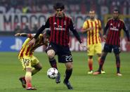 AC Milan's Kaka (R) challenges Daniel Alves (L) of Barcelona during their Champions League soccer match at the San Siro stadium in Milan, October 22, 2013. REUTERS/Stefano Rellandini (ITALY - Tags: SPORT SOCCER)