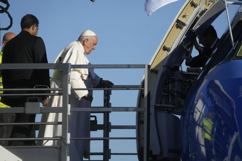 Pope Francis boards his flight to Budapest at Rome's international airport in Fiumicino, Italy, Friday, April 28, 2023. The Pope is on his way to a three-day pastoral visit to Hungary. (AP Photo/Gregorio Borgia)