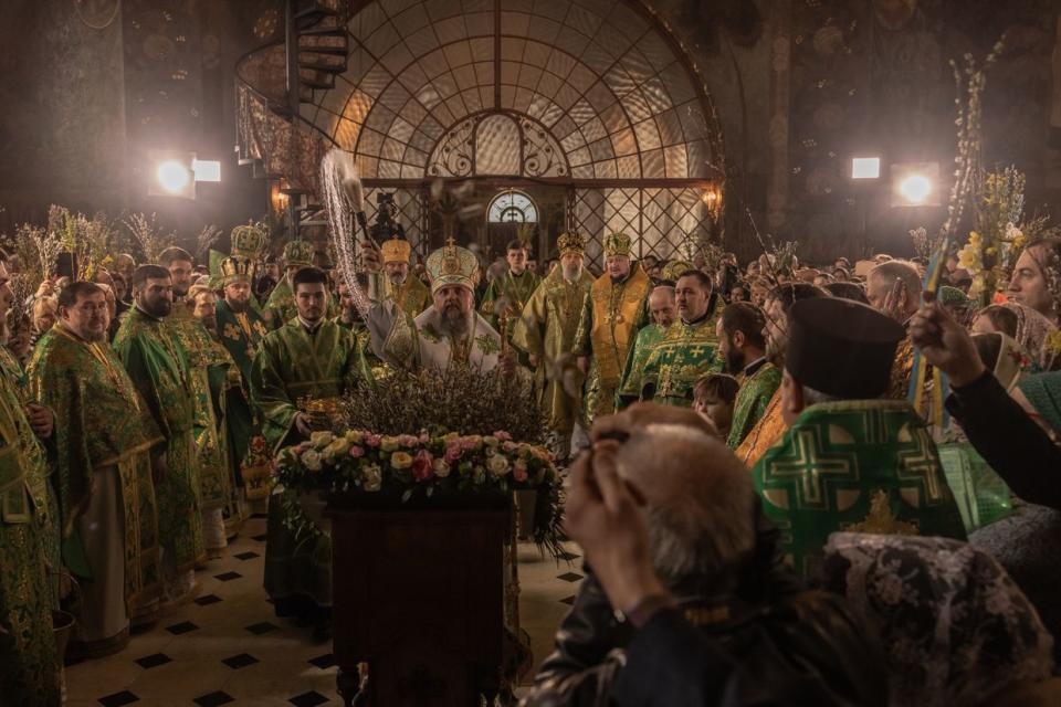 Metropolitan Epiphanius of the Orthodox Church of Ukraine blesses worshipers holding willow branches during the Palm Sunday service in the Kyiv-Pechersk Lavra on April 9, 2023 in Kyiv, Ukraine. (Roman Pilipey/Getty Images)