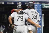 Chicago White Sox's Eloy Jimenez (74) celebrates with Jose Abreu (79) after hitting a two-run home run off Cleveland Indians pitcher Aaron Civale during the fifth inning of a baseball game, Monday, Sept. 21, 2020, in Cleveland. (AP Photo/Ron Schwane)