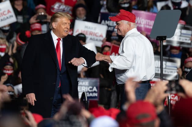 Rep. Mike Kelly (R-Pa.) greets then-President Donald Trump during a campaign in Erie, Pennsylvania, in October 2020. (Photo: Noah Riffe/Anadolu Agency/Getty Images)