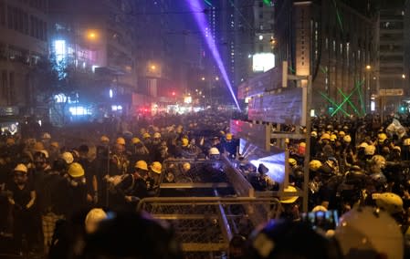 Demonstrators put up a barricade during a protest in Hong Kong