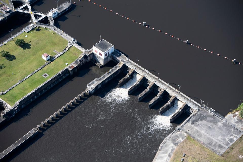 Water moving through the C-44 canal from Lake Okeechobee passes through the St. Lucie Lock and Dam in April 2021 in Martin County.
