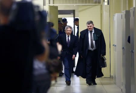 Filmmaker Roman Polanski (C) arrives for a court hearing in Krakow February 25, 2015. REUTERS/Kacper Pempel