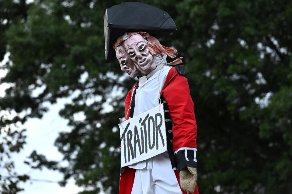 An effigy of Benedict Arnold is seen at the annual Burning of Benedict Arnold Festival, Saturday, Sept. 9, 2023, in New London, Conn. The burning of Arnold marks the anniversary of the day in September 1781 that the Connecticut native led British troops into the city and burned most of it to the ground. (AP Photo/Jessica Hill)