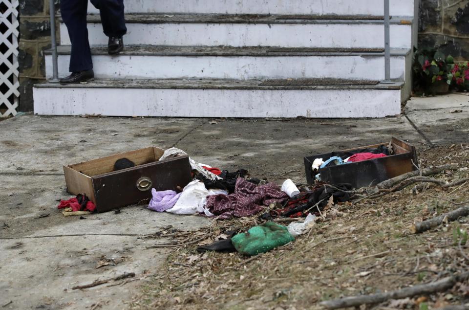 Debris sits outside of a house where a fatal fire occurred overnight in Baltimore, Friday, March 3, 2017, where officials say two people died and four people were critically injured. (AP Photo/Patrick Semansky)