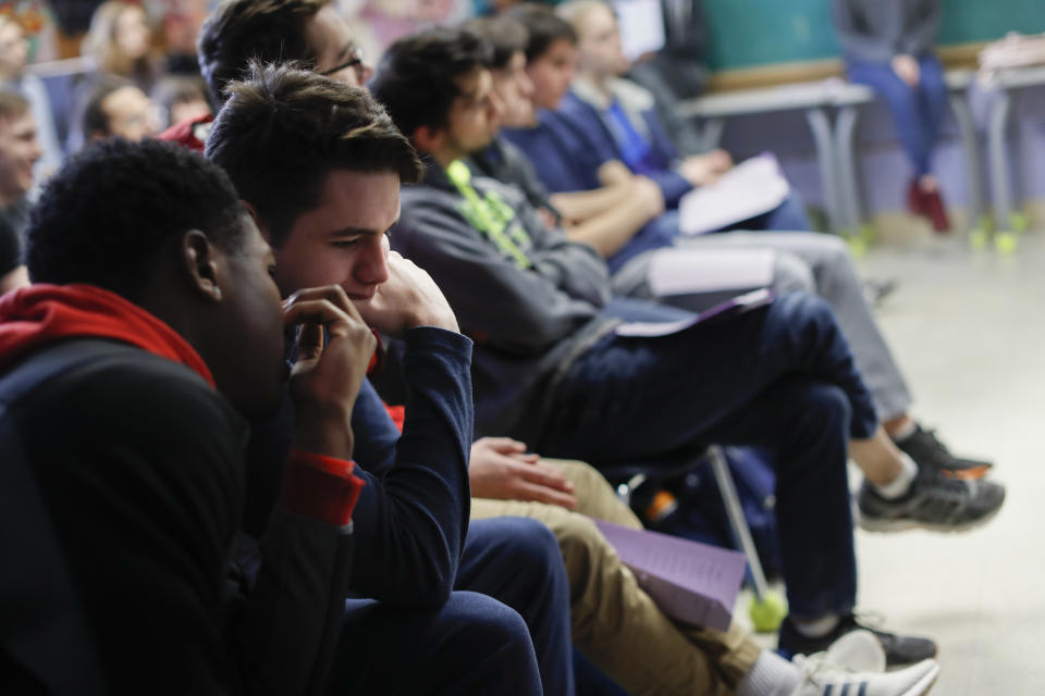 In this Thursday, Jan. 24, 2019, photo students discuss as social studies teachers Judi Galasso and Jonathan Duffy lead the introductory class of their American Thought and Political Radicalism course at Thomas Worthington High School, in Worthington, Ohio. (AP Photo/John Minchillo)