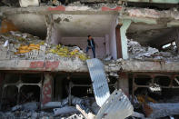 <p>A man stands inside a building that was damaged during security operations and clashes between Turkish security forces and Kurdish militants in YÃ¼ksekova in the southeastern Hakkari province in Turkey on May 30, 2016. (Sertac Kayar/Reuters) </p>