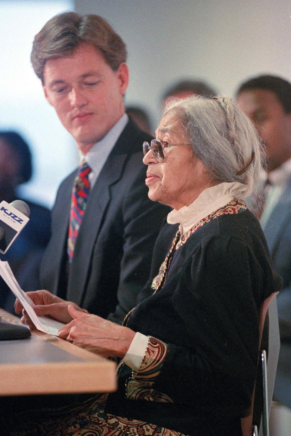 Rosa Parks, joined by Phoenix Mayor Paul Johnson, speaks at a news conference at Phoenix Sky Harbor International Airport following her arrival in Phoenix on Jan. 14, 1993, to celebrate Arizona's first official paid Martin Luther King Jr. holiday.