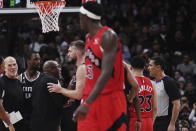 Sacramento Kings head coach Mike Brown, third left, is ejected from the game during the second half of an NBA basketball game against the Toronto Raptors in Toronto on Wednesday, Dec. 14, 2022. (Nathan Denette/The Canadian Press via AP)