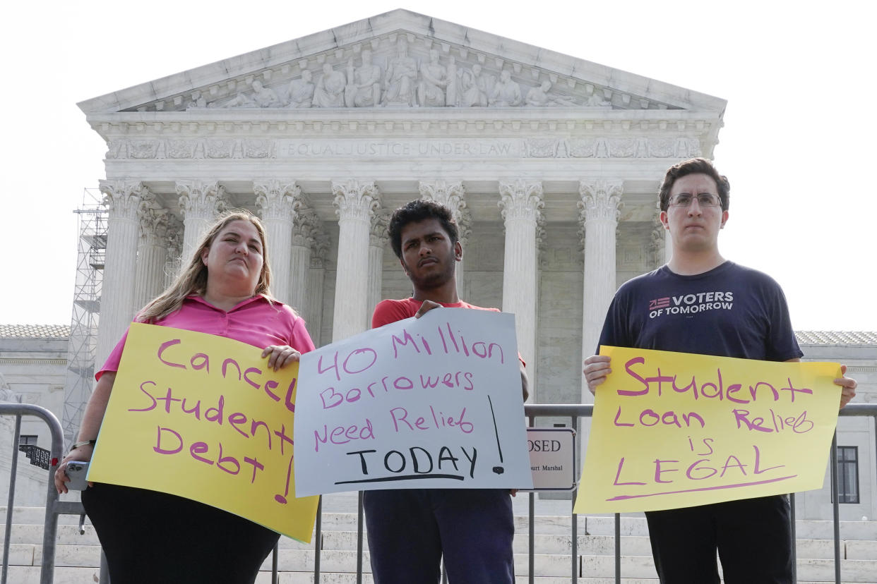 People in favor of canceling student debt protest outside the Supreme Court, Friday, June 30, 2023, as decisions are expected in Washington. (AP Photo/Mariam Zuhaib)