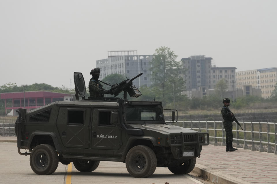 Thai military personnel on an armored vehicle keep guard along the Moei river on the Thai side, under the 2nd Thai-Myanmar Friendship Bridge in Mae Sot in Thailand's Tak province on Friday, April 12, 2024. Thailand’s foreign minister says he has urged Myanmar’s military authorities not to violently respond to its army’s loss of an important border trading town to its opponents, and that so far it seemed to be exercising restraint. (AP Photo/Sakchai Lalit)