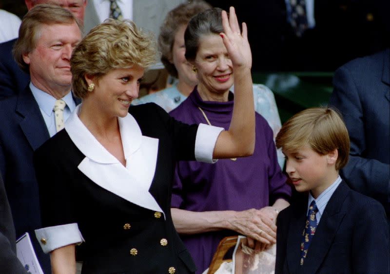 FILE PHOTO: The Princess of Wales, accompanied by her son Prince William, arrives at Wimbledon's Centre Court be..