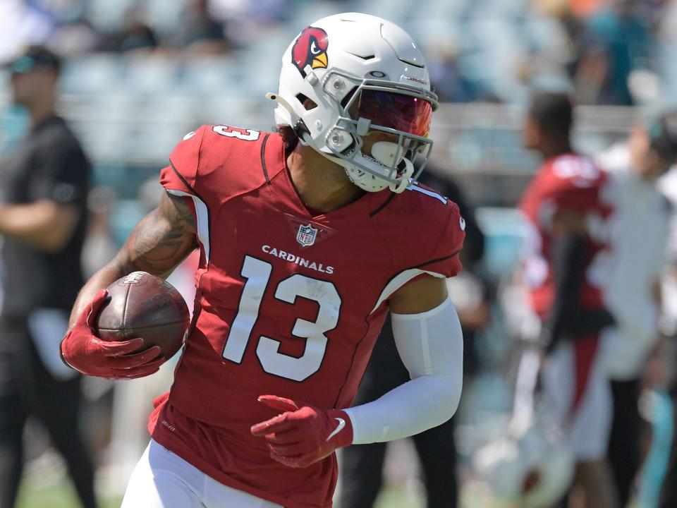 Christian Kirk warms up for a game against the Jaguars.