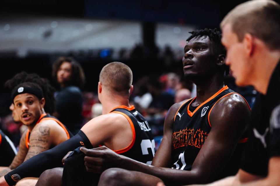 Class of 2024 Kentucky men’s basketball commit Somto Cyril sits on the bench while playing for Team Overtime during The Basketball Tournament in Dayton, Ohio, on Wednesday night. Cyril became the first amateur to play in the event.