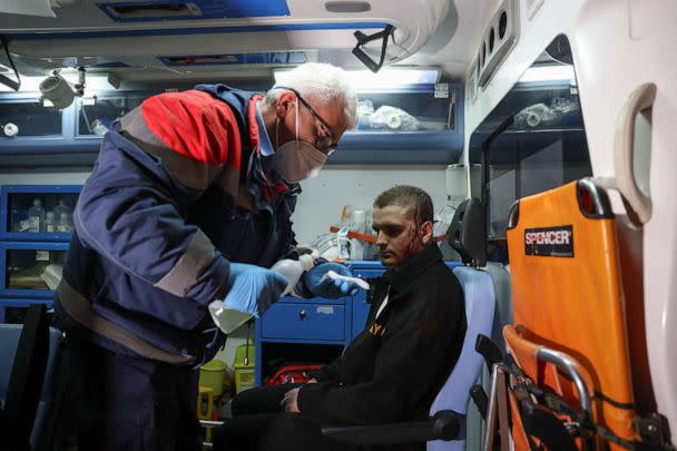 PHOTO: A medic treats an injured passenger, after two trains collided, near the city of Larissa, in Thessaloniki, Greece, March 1, 2023. (Alexandros Avramidis/Reuters)