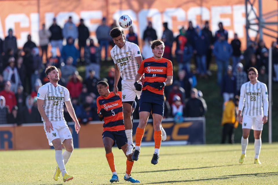 Vermont's Max Murray (left) and Syracuse's Lorenzo Boselli goe up for a header during the Catamounts' 2-1 loss to Syracuse in the NCAA Tournament quarterfinals on Saturday, Dec. 3, 2022.