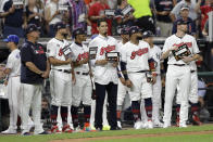 Cleveland Indians pitcher Carlos Carrasco, stands with Indians teammates during the fifth inning of the MLB baseball All-Star Game, Tuesday, July 9, 2019, in Cleveland. Carrasco, the Indians' right-hander, who was recently diagnosed with a form of leukemia, was saluted in the fifth inning of the game as part of Major League Baseball's "Stand Up to Cancer" campaign. (AP Photo/Tony Dejak)