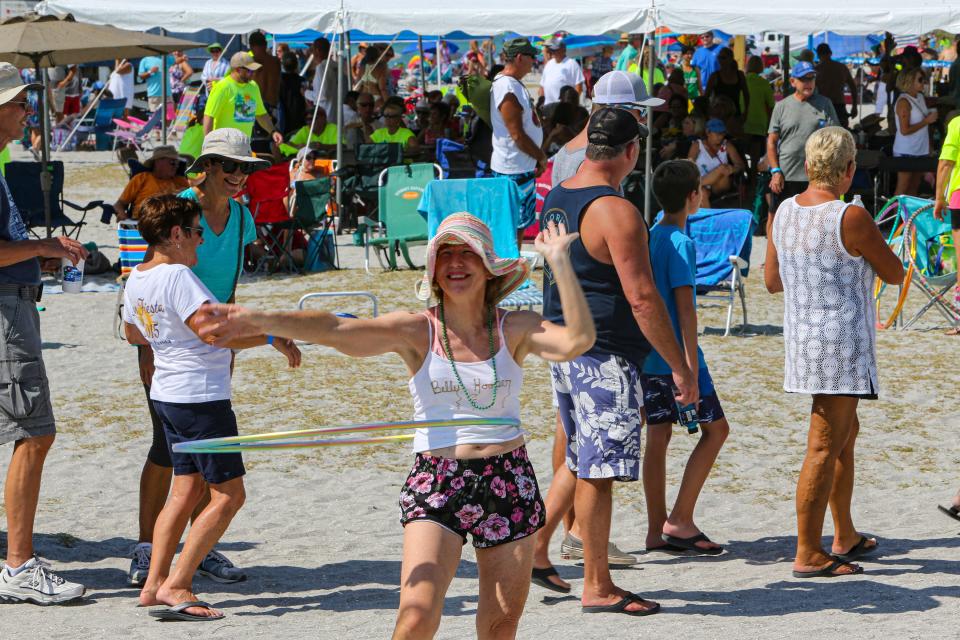 Debi Osborne dances to the Sarasota Steel Pan Band during the fourth annual Venice Beach Party  Saturday, September 28, 2019 at Venice Beach.