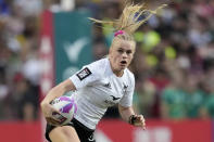 New Zealand's Jorja Miller runs with the ball during the women's final match in the Hong Kong Sevens rugby tournament in Hong Kong, Sunday, April 7, 2024. (AP Photo/Louise Delmotte)