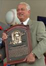 Tommy Lasorda poses with his Hall of Fame plaque after his induction Sunday, Aug. 3, 1997 in Cooperstown, N.Y. (AP Photo/ Dave Jennings)