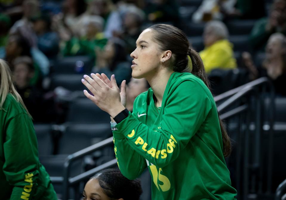 Oregon’s Peyton Scott cheers from the bench as the Oregon Ducks host Arizona State Jan. 12 at Matthew Knight Arena in Eugene.