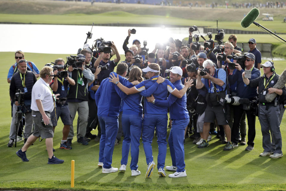 FILE- In this Sept. 30, 2018, file photo, from left, Europe's Justin Rose, Tommy Fleetwood, Ian Poulter and Paul Casey pose for photographers as they celebrate after Europe won the Ryder Cup on the final day of the 42nd Ryder Cup at Le Golf National in Saint-Quentin-en-Yvelines, outside Paris, France. The pandemic-delayed 2020 Ryder Cup returns the United States next week at Whistling Straits along the Wisconsin shores of Lake Michigan. (AP Photo/Matt Dunham, File)