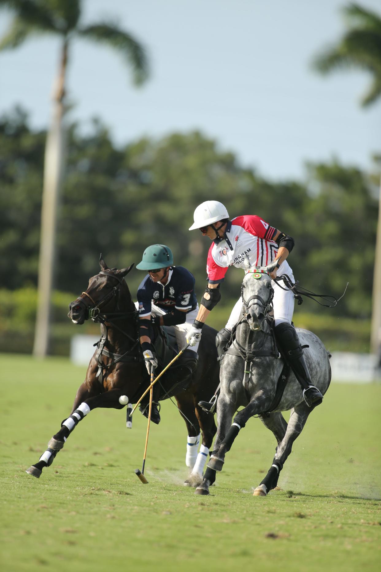 U.S. polo team member Jeff Hall (left), and England's Tommy Beresford, who earned MVP honors, battle during Friday's Westchester Cup match in Wellington.