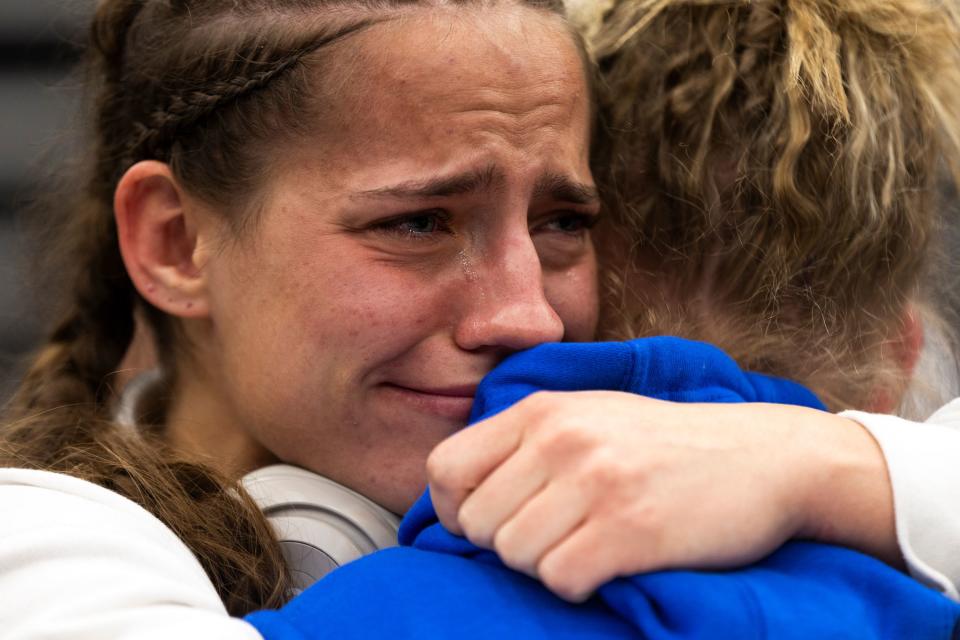 Salem Hills’s Paisley Nelson hugs teammate Kelseigh Banks after competing in the 5A Girls Wrestling State Championships at the UCCU Center in Orem on Thursday, Feb. 15, 2024. | Marielle Scott, Deseret News
