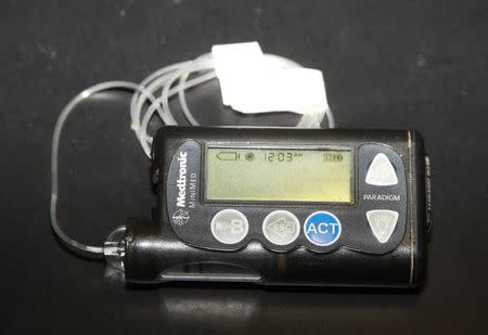 Jay Radcliffe displays a Medtronic Corp insulin pump at his home in Meridian, Idaho October 10, 2014. REUTERS/Brian Losness