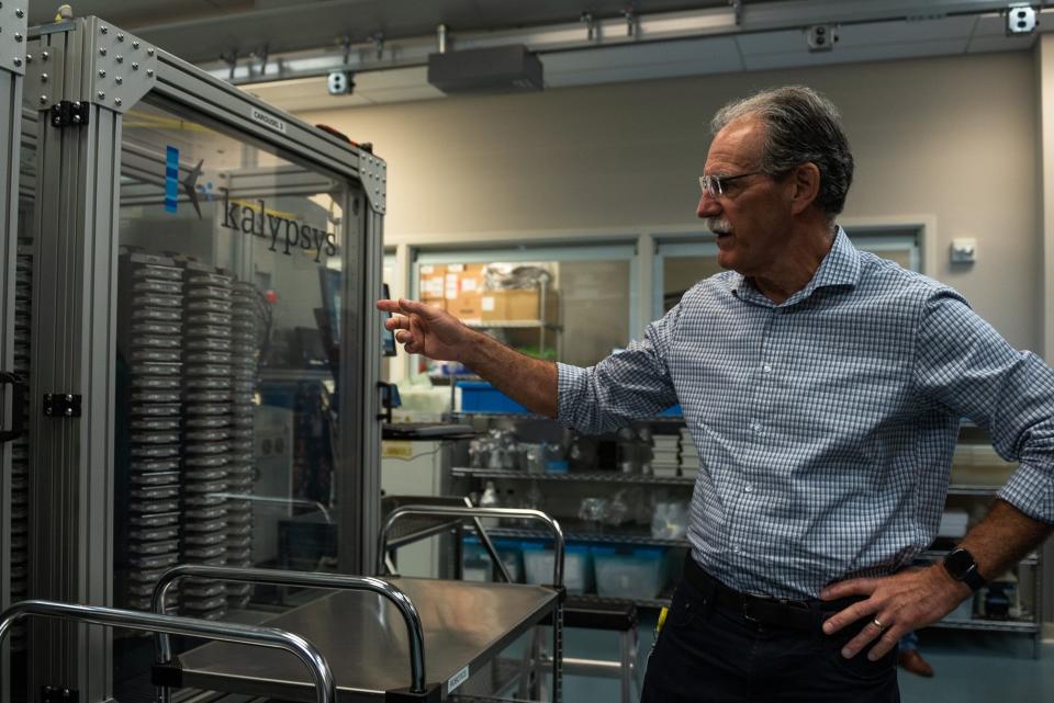Louis Scampavia, Senior Scientific Director of High Throughput Chemistry and Technologies, points to a collection of about 650,000 chemical compounds housed at the Herbert Wertheim UF Scripps Institute for Biomedical Innovation & Technology in Jupiter.