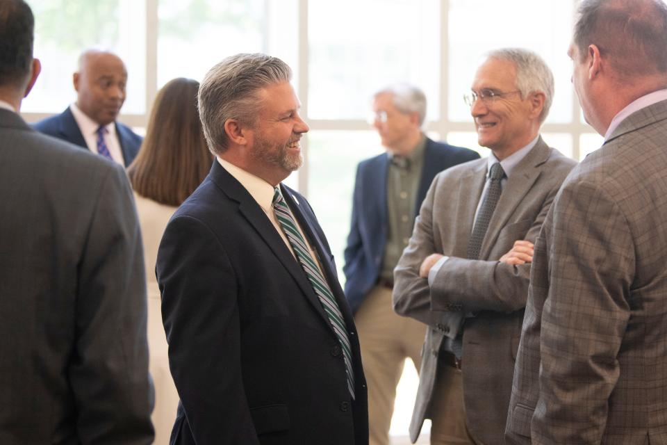 Pellissippi State President Anthony Wise, left, chats with ORNL Interim Director Jeff Smith at Pellissippi's Hardin Valley campus on Wednesday, May 31, 2023. In the fall, Pellissippi will begin offering classes in Radiochemistry, Analytical Chemistry, and Hazardous Waste Control to be taught by ORNL scientists. 