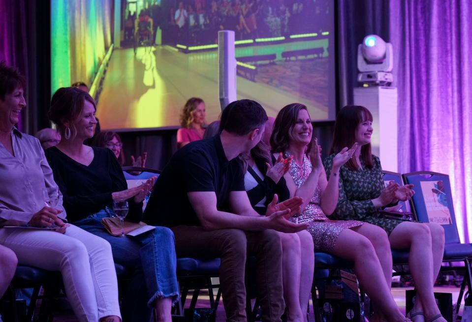 Audience members clap during the Style Show in downtown Sioux Falls on Saturday, May 7, 2022.