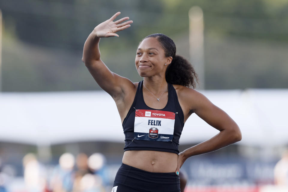 Allyson Felix waves to fans before her 400-meter dash heat at the U.S. Championships athletics meet, Friday, July 26, 2019, in Des Moines, Iowa. (AP Photo/Charlie Neibergall)