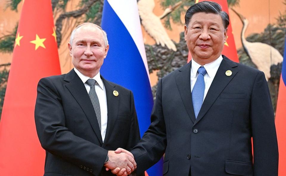 普丁（左）今年再度連任，傳出他5月將訪問中國。右為中國國家主席習近平。（翻攝自President of Russia）