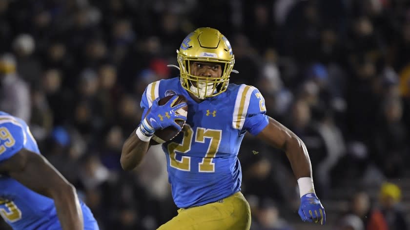 UCLA running back Joshua Kelley runs the ball