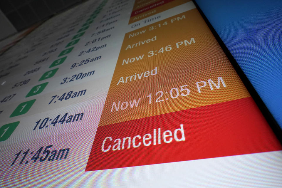 A flight board displays a cancelled flight at Logan International Airport, Wednesday, Jan. 11, 2023, in Boston. Thousands of travelers were stranded at U.S. airports due to an hours-long computer outage. If a flight is canceled, experts say most airlines will rebook you on the next available flight. But if you choose to cancel the trip, airlines must provide you with a full refund.(AP Photo/Steven Senne)