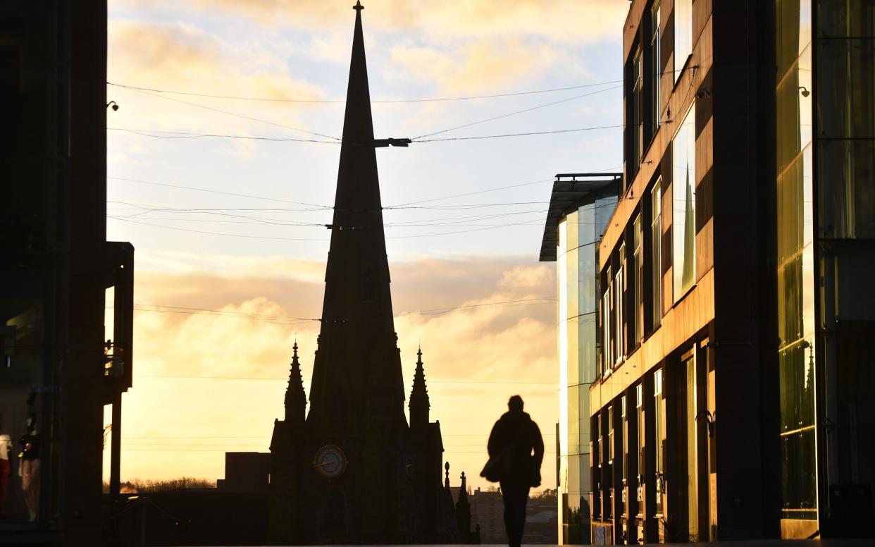 A man walks past St Martins Church in Birmingham during the nationwide lockdown -  Nathan Stirk/Getty 