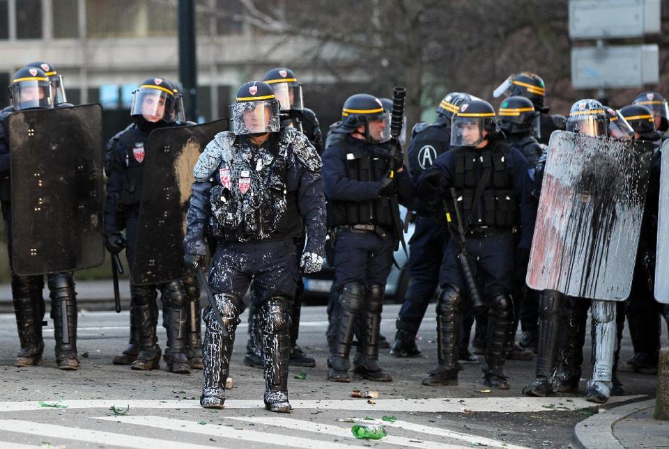 Demonstrators clash with French riot police during a demonstration in Nantes, Saturday Feb.22, 2014, as part of a protest against a project to build an international airport, in Notre Dame des Landes, near Nantes. The project was decided in 2010 and the international airport should open by 2017. (AP Photo/ Laetitia Notarianni)