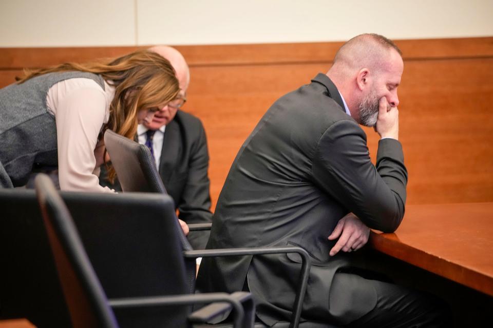 Feb 16 2024; Columbus, Ohio, USA; Michael Jason Meade covers his face while waiting for Judge David Young to return to the courtroom in his trial at the Franklin County Common Pleas Court.