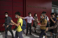 Visitors line up to enter the Hong Kong Palace Museum during the first day open to public in Hong Kong, Sunday, July 3, 2022. The museum showcases more than 900 Chinese artefacts, loaned from the long-established Palace Museum in Beijing, home to works of art representing thousands of years of Chinese history and culture. (AP Photo/Kin Cheung)