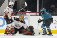 San Jose Sharks center Scott Reedy, right, scores a goal past Anaheim Ducks goaltender Anthony Stolarz (41) during the second period in an NHL hockey game Tuesday, April 26, 2022, in San Jose, Calif. (AP Photo/Tony Avelar)