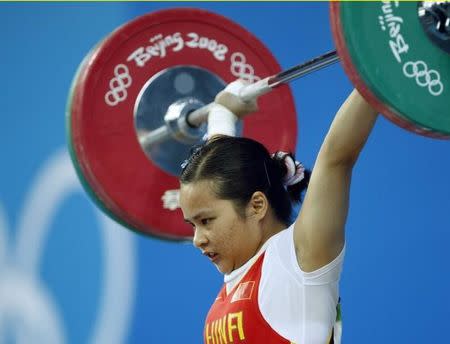 Chen Xiexia of China competes in the women's 48kg Group A snatch weightlifting competition at the Beijing 2008 Olympic Games August 9, 2008. REUTERS/Oleg Popov/Files