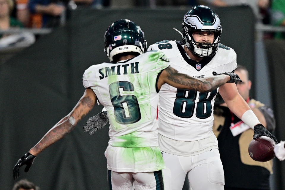 TAMPA, FLORIDA – JANUARY 15: Dallas Goedert #88 of the Philadelphia Eagles celebrates with DeVonta Smith #6 after scoring a touchdown against the Tampa Bay Buccaneers during the second quarter in the NFC Wild Card Playoffs at Raymond James Stadium on January 15, 2024 in Tampa, Florida. (Photo by Julio Aguilar/Getty Images)