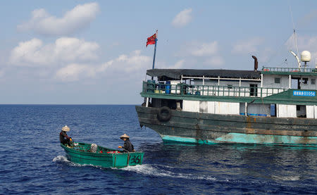 Chinese fishermen head to the shoal to fish at the disputed Scarborough Shoal April 6, 2017. Picture taken April 6, 2017. REUTERS/Erik De Castro