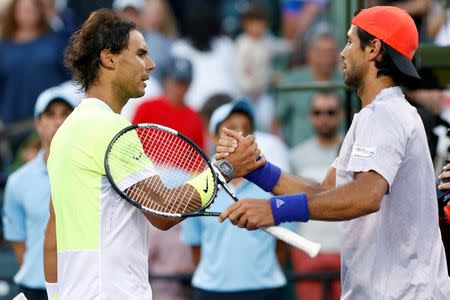 Mar 29, 2015; Key Biscayne, FL, USA; Fernando Verdasco (R) shakes hands with Rafael Nadal (L) after their match on day seven of the Miami Open at Crandon Park Tennis Center. Geoff Burke-USA TODAY Sports