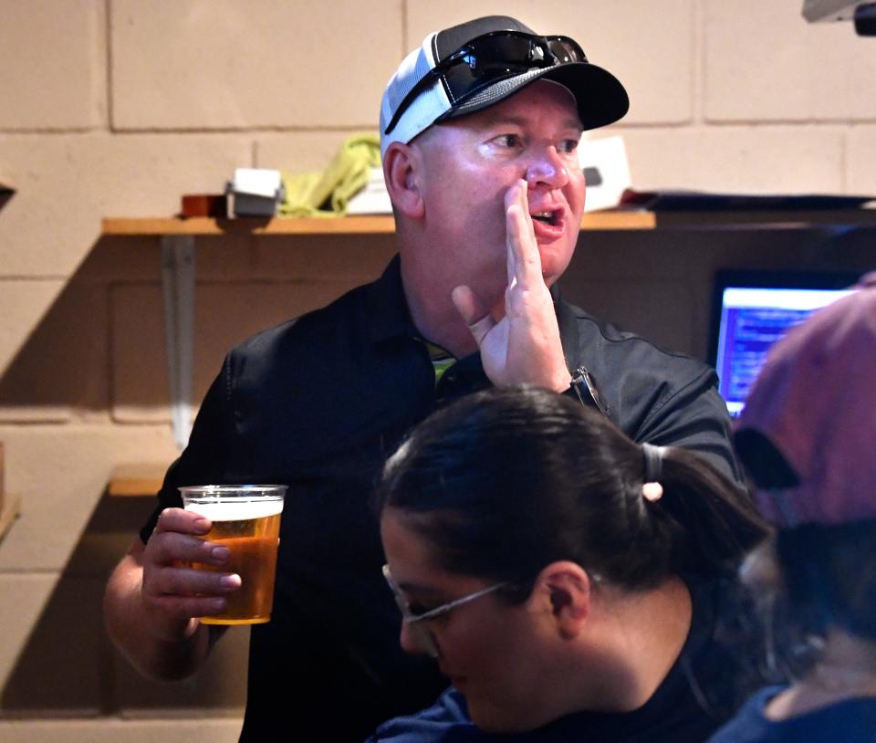 Richy Waggoner jokes with a customer as he pulls a beer for them from the taps at Pappy Slokum Brewing Company. Waggoner is one of the owners and several of the brew pub's offerings harken back to his day-job as an assistant chief for the Abilene Police Department.